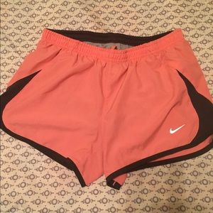 Coral/orange Nike shorts