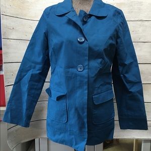 Turquoise rain coat. Looks like pea coat.