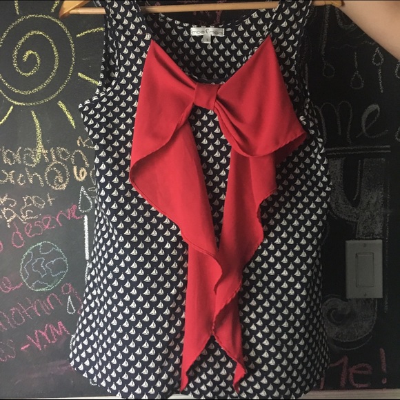 Never worn flowy top with bow on front!
