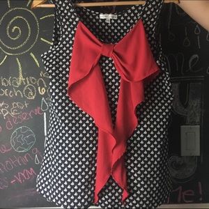 Never worn flowy top with bow on front!