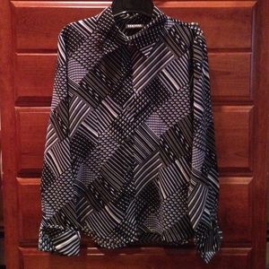 Long sleeve black, cream, and soft blue top.