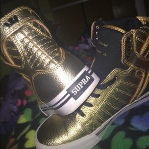 Gold and black supra high tops