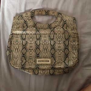 Animal print snake skin clutch.