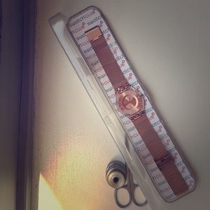 Swatch rose stainless steel skin
