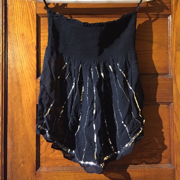 Strapless black top. Rouched bust, sheer bodice