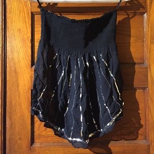 Strapless black top. Rouched bust, sheer bodice