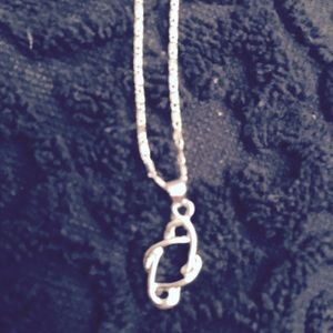 A 925 Sterling Silver Infinity Chsrm and chain