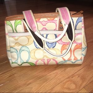 white coach purse with colored c's