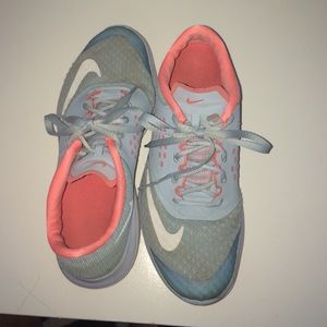 Blue and pink Nike tennis shoes.