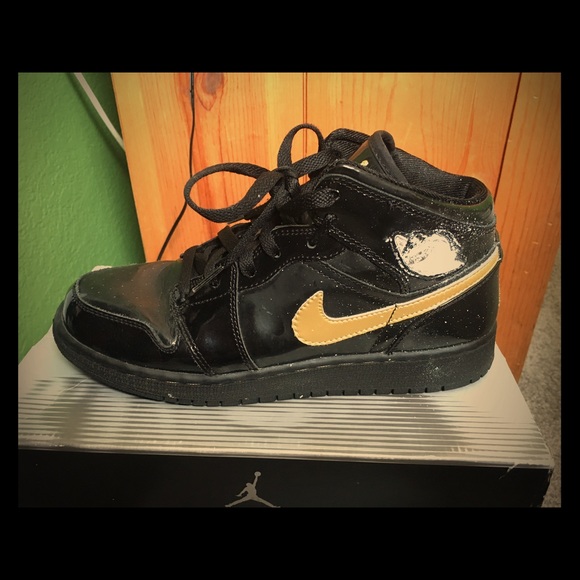 Gold and black Jordans