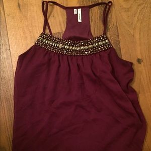 Tank with embellishments