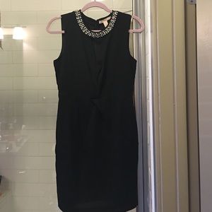 Black pearled dress.