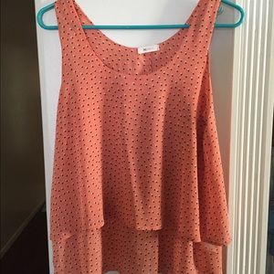 Peach color polka dotted patterned blouse