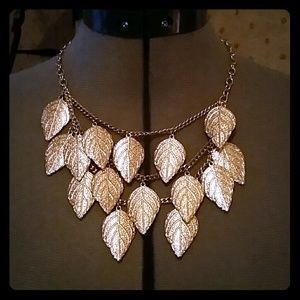 Gold layered feather necklace