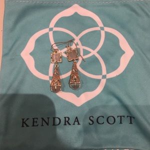 Gold Kendra Scott earrings with slate stone.