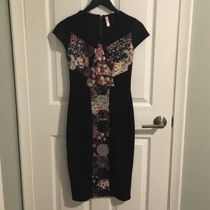 Longer black fitted dress with floral detail