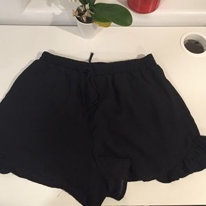 Black ruffled shorts