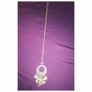 Long gold colored necklace