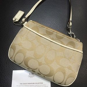 Authentic Small Coach Wristlet.