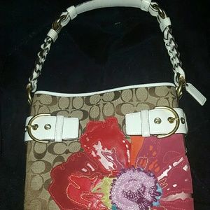 Brand new authentic floral embossed Coach purse!