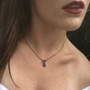 Cat diamond silver necklace.