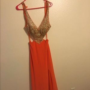 Orange, open back prom dress.