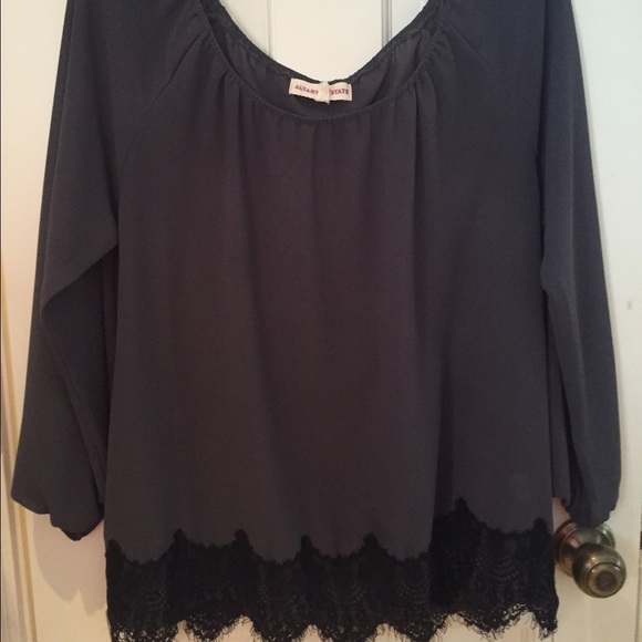 Grey long sleeve shirt with black bottom lace