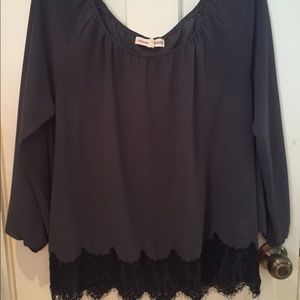 Grey long sleeve shirt with black bottom lace