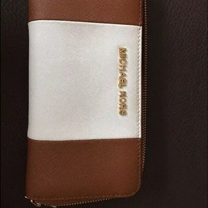 Tan and white stripped michael kors wallet