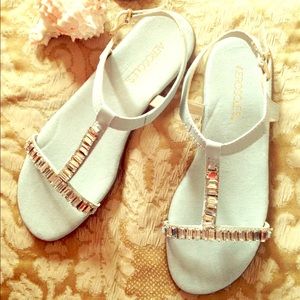 Jeweled t-strap suede sandals in powder blue.