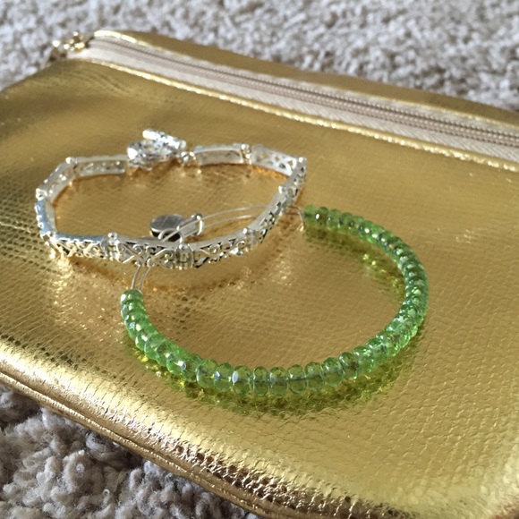 Silver bracelet paired with an Alex and ani