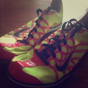 Neon pink and green Nike spikes