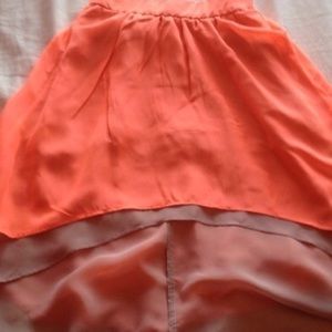 Orange layered over grey high low skirt