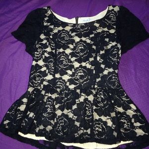 Beige and black peplum top