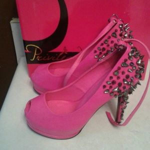 Privileged fuchsia arrow heels