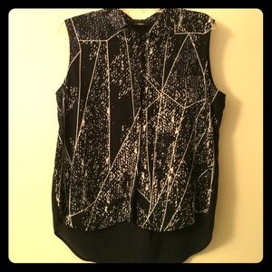 Button-up, sleeveless, high-low blouse.