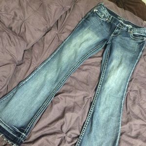 Distressed curvy fit flare jeans