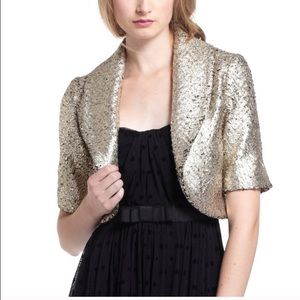 Anthropologie gold crackle party cropped jacket.