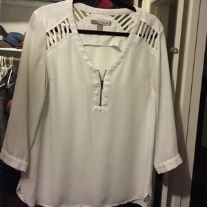 White blouse with cut outs on shoulders