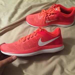Women's size 8 Nike shoes. The color is Coral.