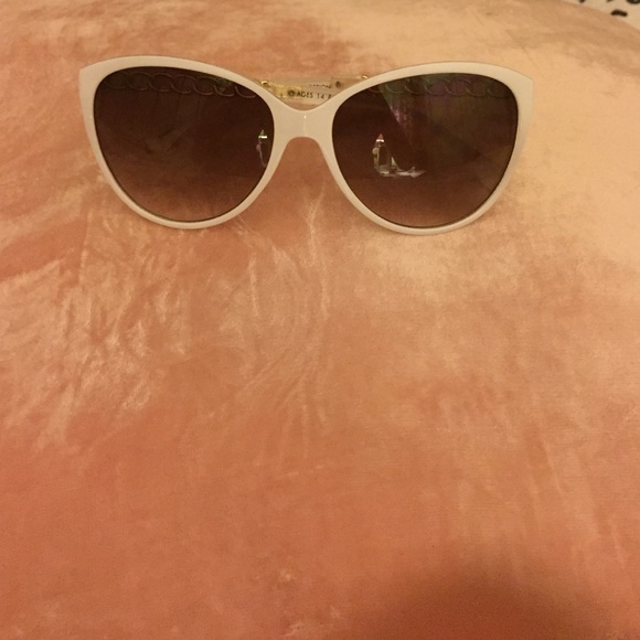 White & gold plastic sunglasses.