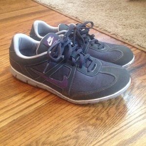 Dark gray and purple Nike sneakers