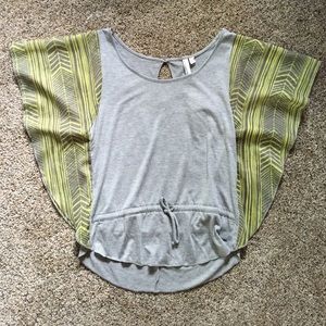Tank top with shear sleeves.