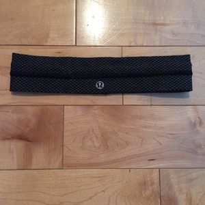 A black and white lululemon athletica headband