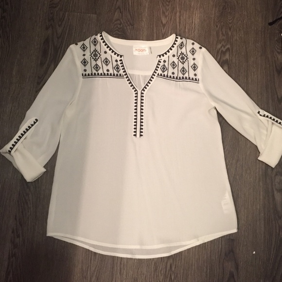 White, dark blue v-neck blouse,