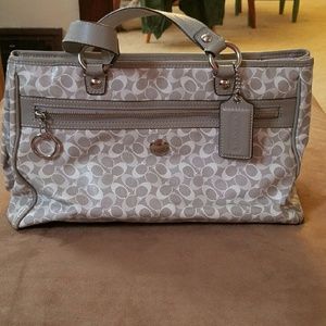 Gray and white coach purse