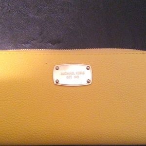Michael Kors yellow zip around wallet