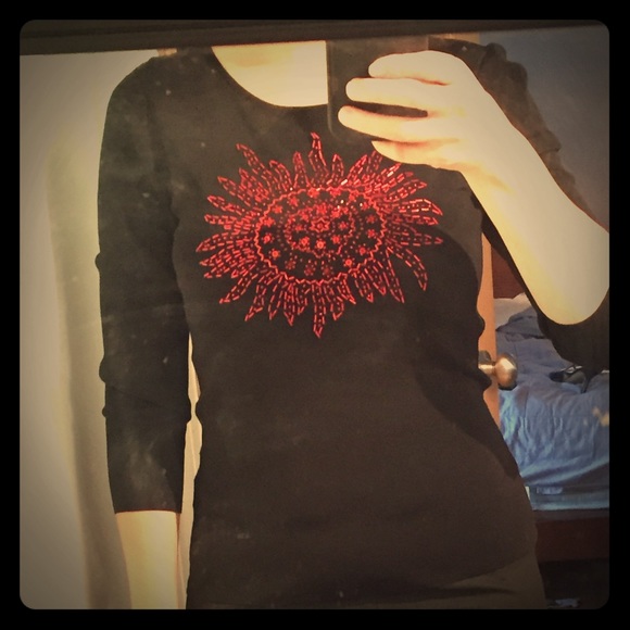 Black knit top with red beaded design