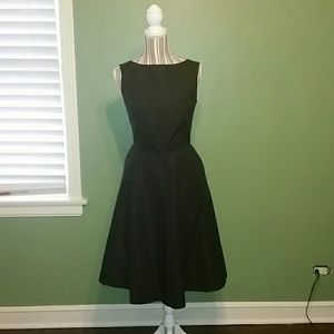 IT HAS POCKETS ;) Black fit and flare dress.