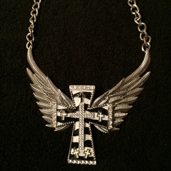 Cross with wings necklace. Zebra print. 22" long. - Picture 2 of 3